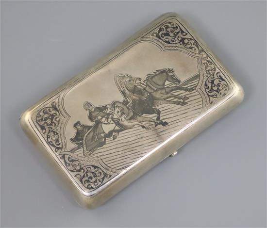 A late 19th century Russian 84 zolotnik silver and niello cigarette case, decorated with troika scene, gross 143 grams.